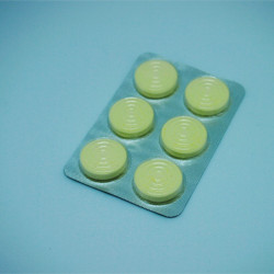 YELLOW CANDIES IN BLISTER PACK